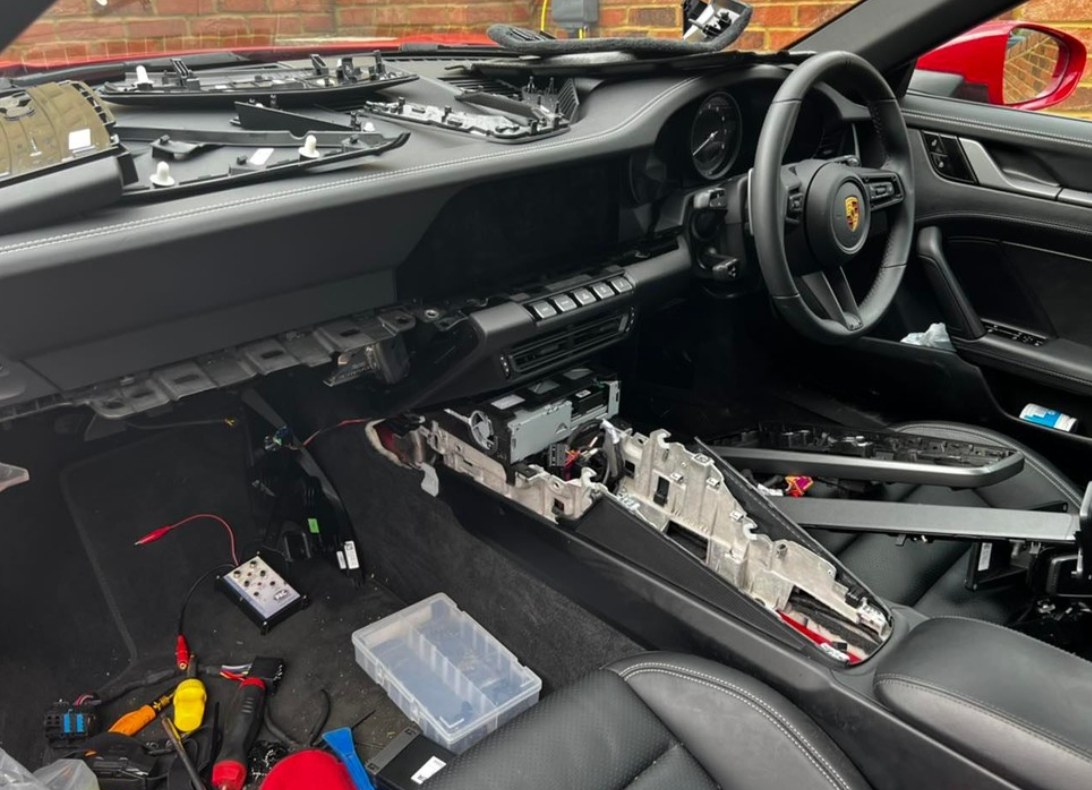 Vehicle interior during dashboard strip-down for AVIT installation work